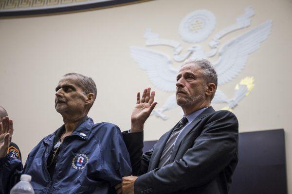 Retired New York Police Department detective and 9/11 responder Luis Alvarez, left, and Former Daily Show Host Jon Stewart, right are sworn in before testifying during a House Judiciary Committee hearing on reauthorization of the September 11th Victim Compensation Fund on Capitol Hill on June 11, 2019, in Washington, DC. (Zach Gibson/Getty Images)