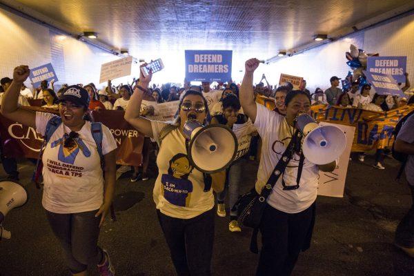 Demonstrators march through a tunnel during a demonstration in response to the Trump Administration's announcement that it would end the Deferred Action for Childhood Arrivals (DACA) program in Washington on Sept. 5, 2017. (Zach Gibson/Getty Images)