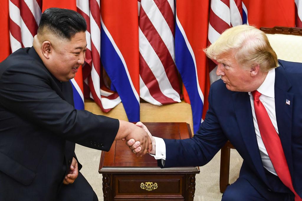 North Korea's leader Kim Jong Un (L) and President Donald Trump shake hands during a meeting on the south side of the Military Demarcation Line that divides North and South Korea, in the Joint Security Area (JSA) of Panmunjom in the Demilitarized zone (DMZ) on June 30, 2019. (Brendan Smialowski/AFP/Getty Images)
