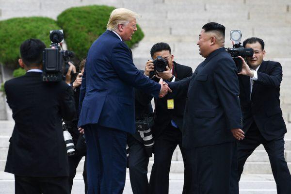 President Donald Trump shakes hands with North Korea's dictator Kim Jong Un north of the Military Demarcation Line that divides North and South Korea, in the Joint Security Area (JSA) of Panmunjom in the Demilitarized zone (DMZ) on June 30, 2019. (Brendan Smialowski/AFP/Getty Images)