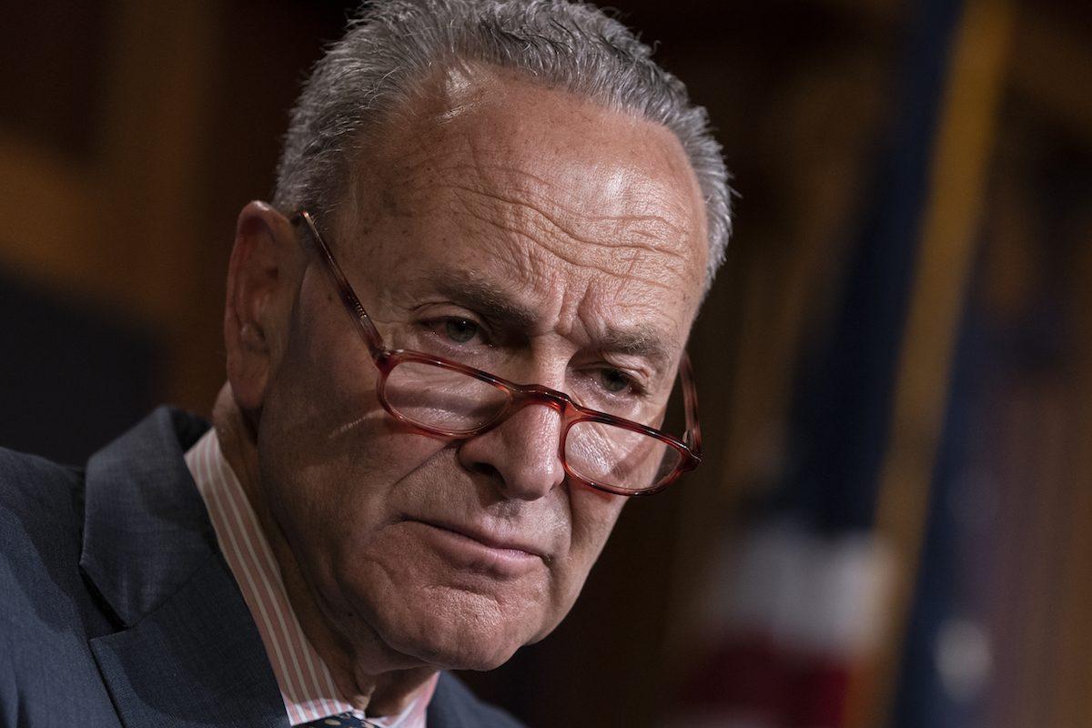 Senate Minority Leader Chuck Schumer (D-N.Y.) talks to reporters at the Capitol in Washington in a file photograph. (J. Scott Applewhite/AP Photo)
