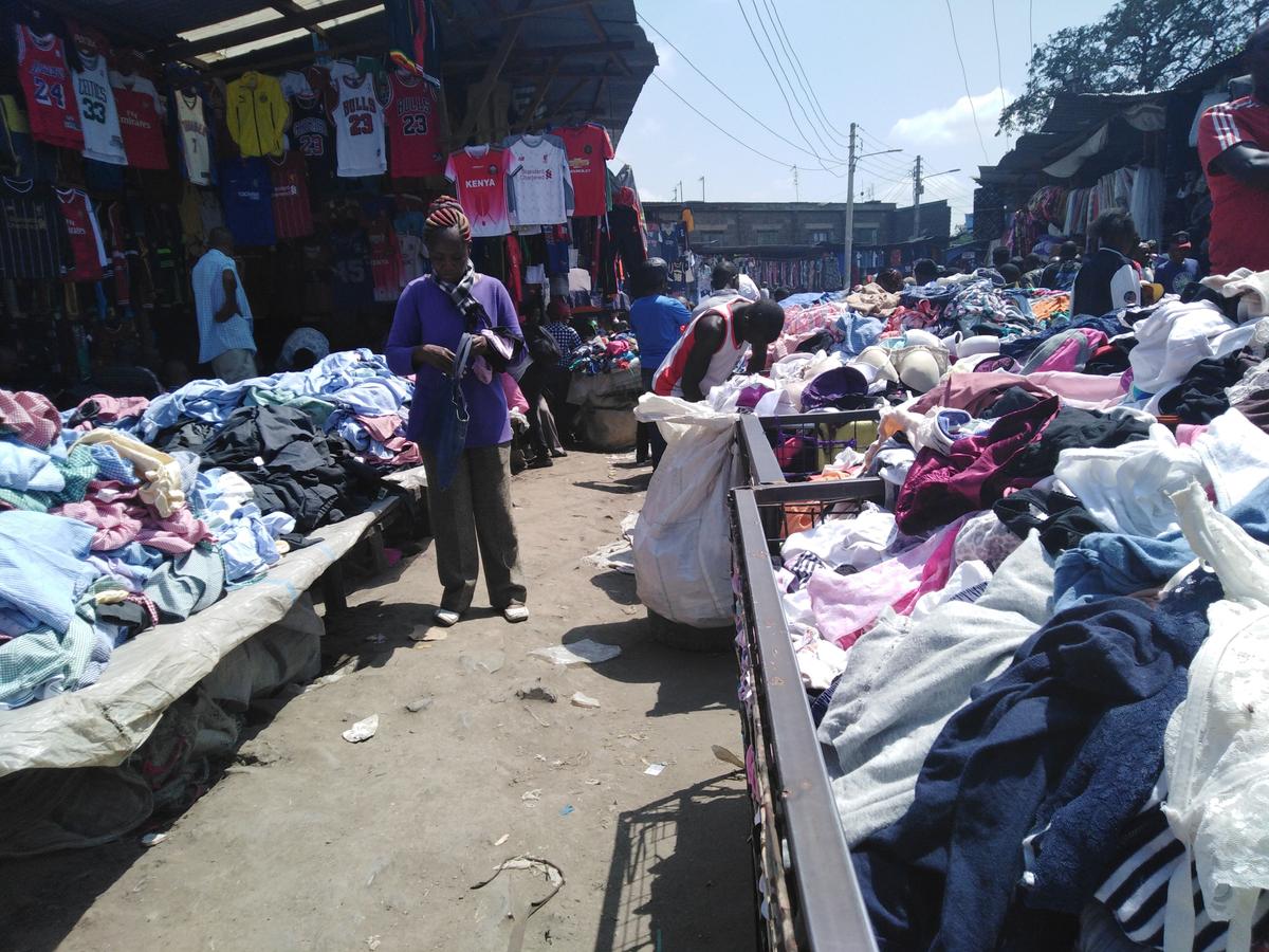 A woman shopping for second-hand clothes in Nairobi's Gikomba market, Kenya, on June 19, 2019. (Dominic Kirui/The Epoch Times)