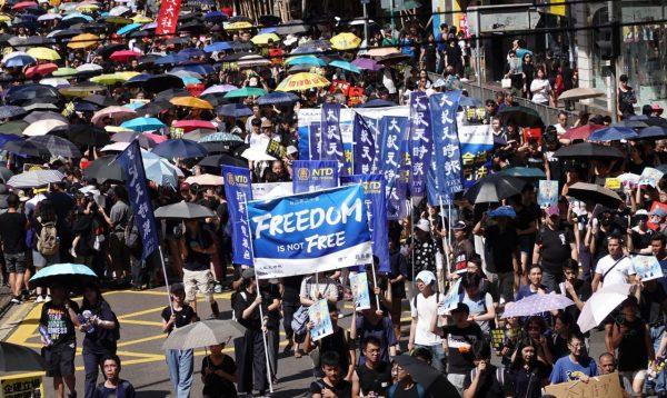 Epoch Media Group takes part in a march in Hong Kong on July 1, 2019. (Yu Gang/The Epoch Times)