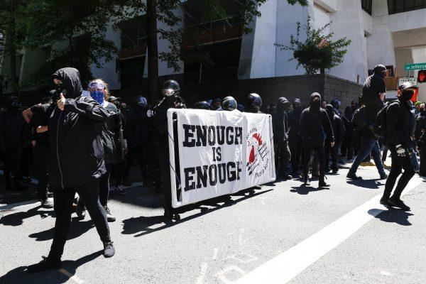 The Rose City Antifa prepare to march in opposition to members of HimToo and Proud Boys in Portland, Oregon on June 29, 2019. (Moriah Ratner/Getty Images)