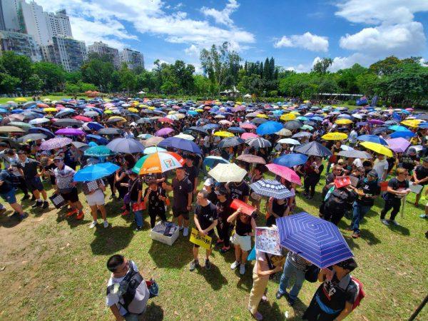 People holding umbrella gather at Victoria Park, the starting point of the anniversary march, in Hong Kong on July 1, 2019. (Sun Qingtian/The Epoch Times)