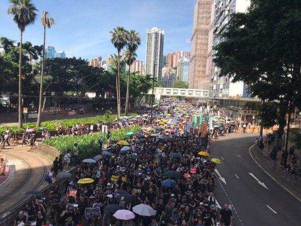 Protesters begin to march from Victoria Park in Hong Kong on July 1, 2019. (Lin Yi/The Epoch Times)