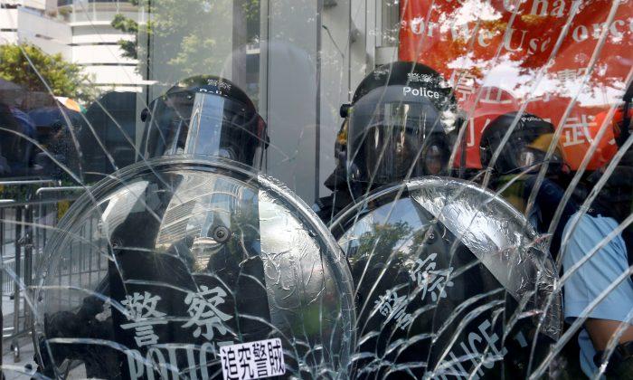 Hong Kong Police Tactics Baffle Security Experts as Legislature Building Is Trashed