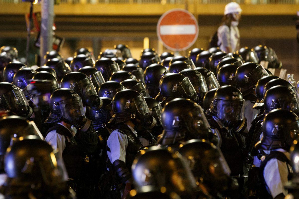 Riot police clear the streets outside the Legislative Council building, after protesters stormed the building on the anniversary of Hong Kong's handover to China, in Hong Kong, China, on July 2, 2019. (Thomas Peter/Reuters)