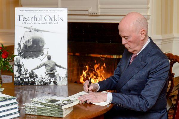 Chuck Newhall III signing copies of his memoir "Fearful Odds." (Sharon Redmond)
