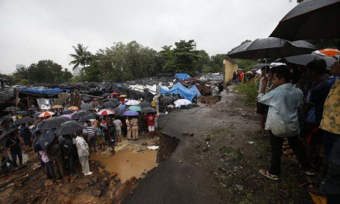 Multiple Walls Collapse in India Monsoon Rains, Killing 31