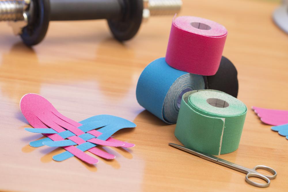 Illustration - Shutterstock | <a href="https://www.shutterstock.com/image-photo/special-physio-tape-rolling-330602564?studio=1">Patricia Chumillas</a>