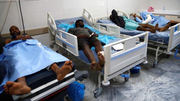 Wounded migrants lie on hospital beds after an air strike hit a detention center for mainly African migrants in Tajoura, in Tripoli Central Hospital, Libya on July 3, 2019. (Ismail Zitouny/Reuters)