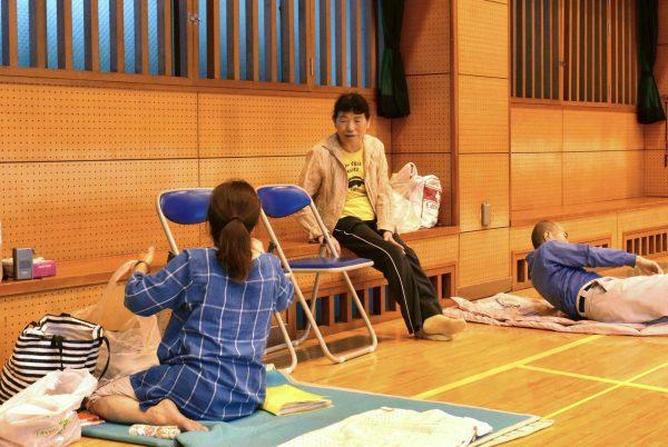 Local residents take a rest at a shelter in evacuation center as heavy rains threatened to trigger landslides and cause other damage, in Kagoshima, Japan on July 3, 2019. (Kyodo/via Reuters)