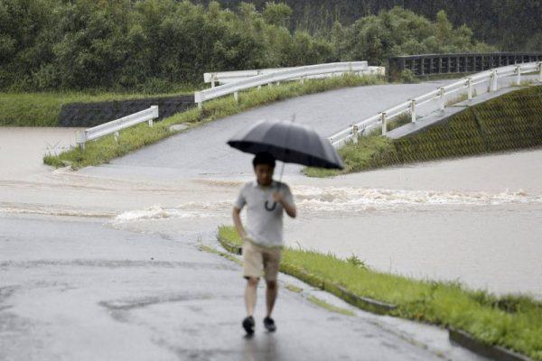 A flooded road is seen during heavy rain on July 3, 2019, in Soo City, Kagoshima Prefecture, southwest Japan. (Kyodo News via AP)