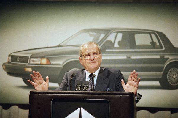 Chrysler Corp. Chairman Lee Iacocca gestures while speaking about fourth quarter pre-tax earnings which are up 23.8 percent for the automaker, in Grand Hyatt Hotel, New York, on Feb. 2, 1989. (Mario Cabrera/AP Photo)