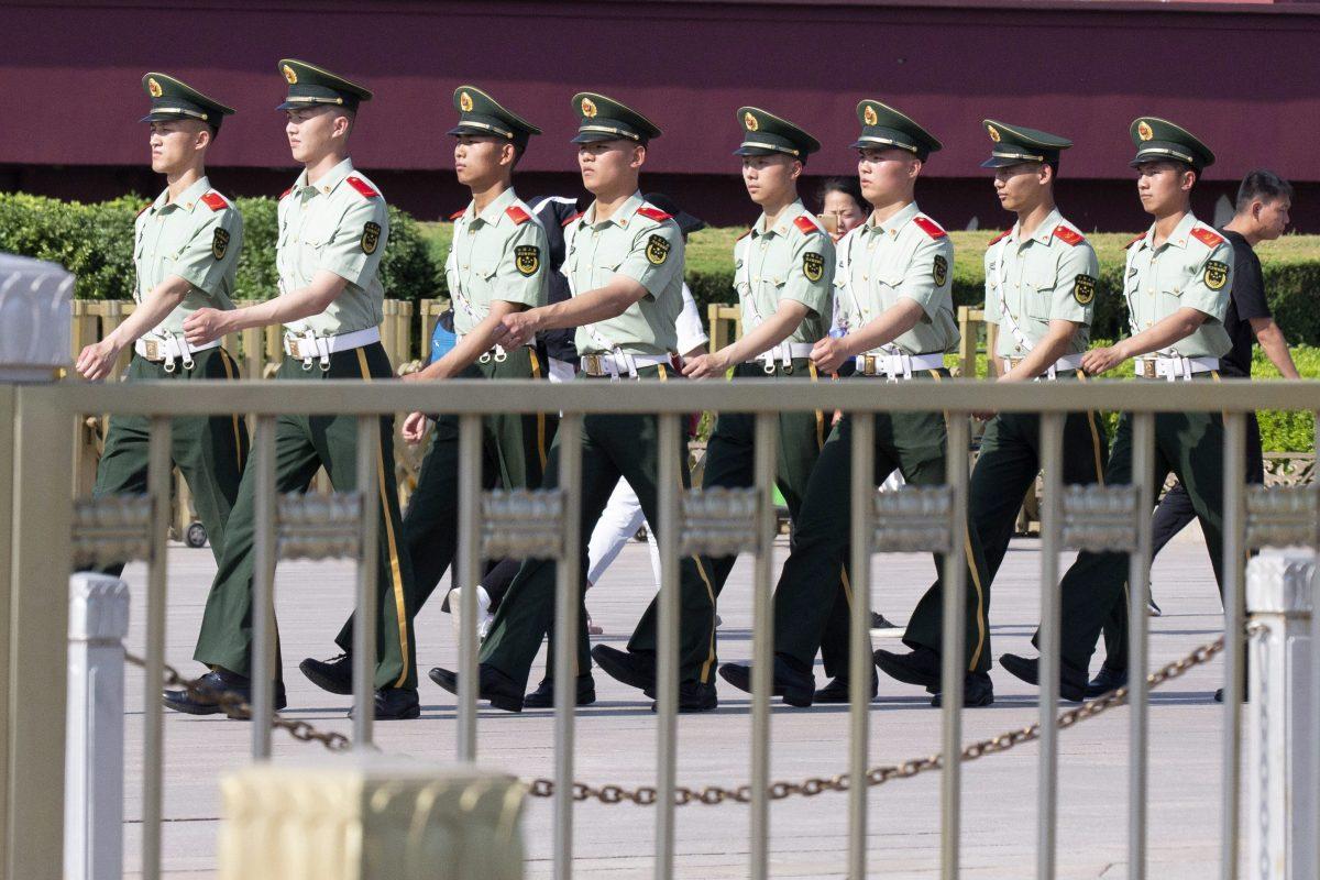 Chinese paramilitary police march past Tiananmen Gate on the eve of the 30th anniversary of the 1989 crackdown on pro-democracy protest in Beijing on June 3, 2019. (AP Photo/Ng Han Guan)