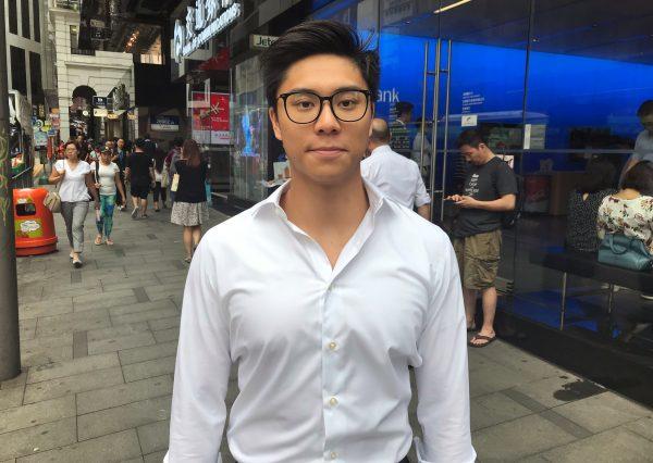 Investment banker Daniel Yim, 27, poses for a picture in Central, Hong Kong, China on July 2, 2019. (Aleksander Solum/Reuters))