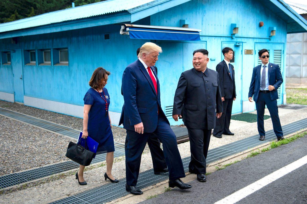 President Donald Trump and North Korean leader Kim Jong Un walk together south of the Military Demarcation Line that divides North and South Korea, on June 30, 2019. (BRENDAN SMIALOWSKI/AFP/Getty Images)