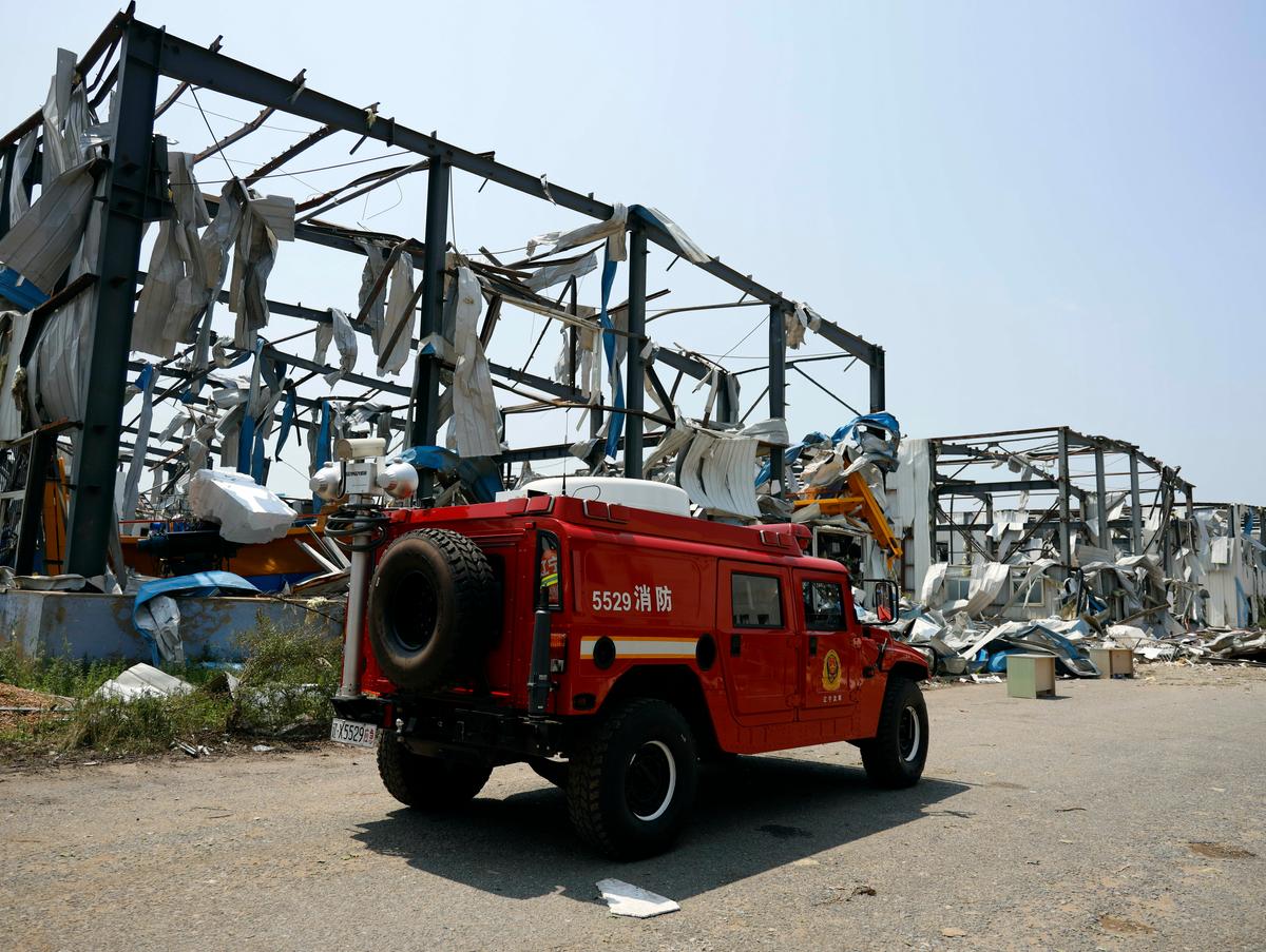 A fire truck past by a destroyed factory in the aftermath of a tornado in Kaiyuan, Liaoning Province, China on July 4, 2019. (Chinatopix Via AP)