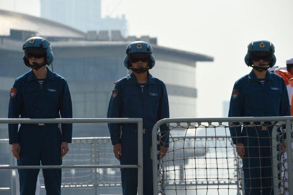 Chinese pilots onboard the guided-missile frigate Wuhu (539) stand in formation shortly after docking at the international port in Manila on Jan. 17, 2019. (Ted Aljibe/AFP/Getty Images)