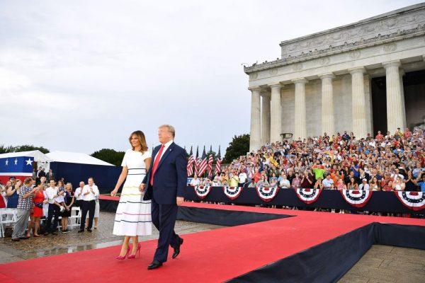 President Donald Trump (R) and First Lady Melania Trump walk onstage during the "Salute to America" Fourth of July event at the Lincoln Memorial in Washington on July 4, 2019. (Mandel Ngan/AFP/Getty Images)