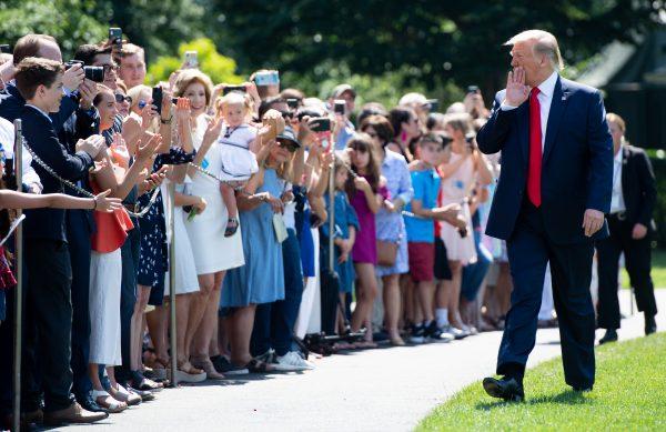 President Donald Trump greets guests prior to departing on Marine One from the South Lawn of the White House in Washington on July 5, 2019. (Saul Loeb/AFP/Getty Images)