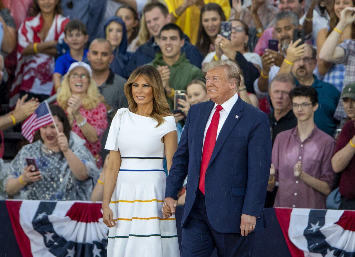 President Donald Trump and first lady Melania Trump take the stage on July 04, 2019 in Washington, DC. President Trump is holding a "Salute to America" celebration on the National Mall on Independence Day this year with musical performances, a military flyover, and fireworks. (Tasos Katopodis/Getty Images)