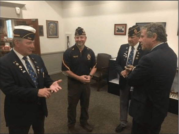 U.S. Sen. Sherrod Brown (D-OH) with local veterans as he reintroduces bipartisan legislation, the All-American Flag Act, in Kettering on July 2, 2019. (Media Release)