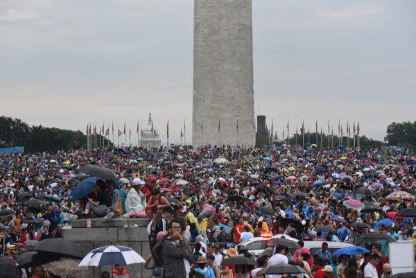 People gather on the National Mall while President Donald Trump gives his speech during Fourth of July festivities on July 4, 2019 in Washington, DC. (Stephanie Keith/Getty Images)