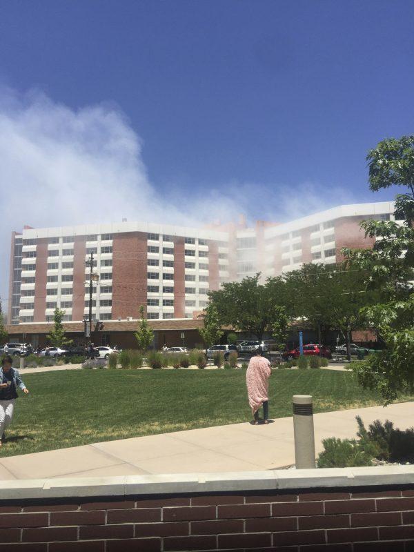 Plumes of smoke from an explosion inside a residence hall at the University of Nevada, Reno in Reno, Nev., is visible on July 5, 2019. (Raymond Floyd via AP)