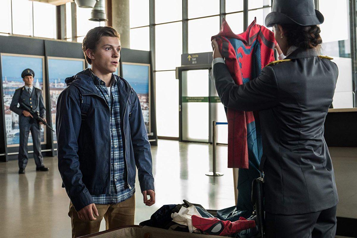 Spider-Man (Tom Holland) finds it challenging to declare to a French airport customs officer exactly what is in his suitcase, in Columbia Pictures’ “Spider-Man: Far From Home.” (Sony Pictures)