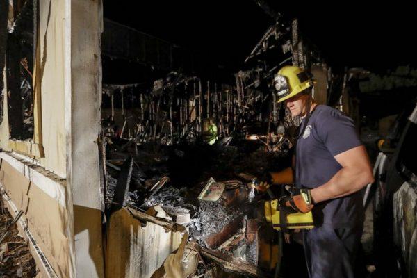 A fireman looks over a home that burned after an earthquake in Ridgecrest, Calif., on July 6, 2019. (Marcio Jose Sanchez/AP Photo)