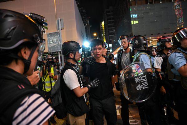 A protester is arrested during a stand-off with the police in the Mong Kok district after a demonstration at West Kowloon railway station protesting against the proposed extradition bill on July 7, 2019, in Hong Kong. (Billy H.C. Kwok/Getty Images)