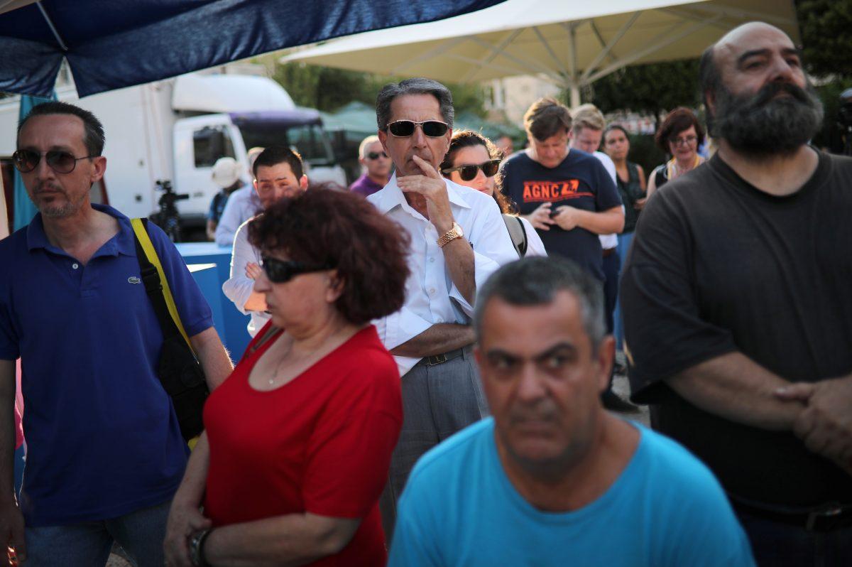 Supporters of New Democracy conservative party are seen at the party's main election kiosk after the announcement of the first exit polls in Athens, Greece, on July 7, 2019. (Alkis Konstantinidis/Reuters)