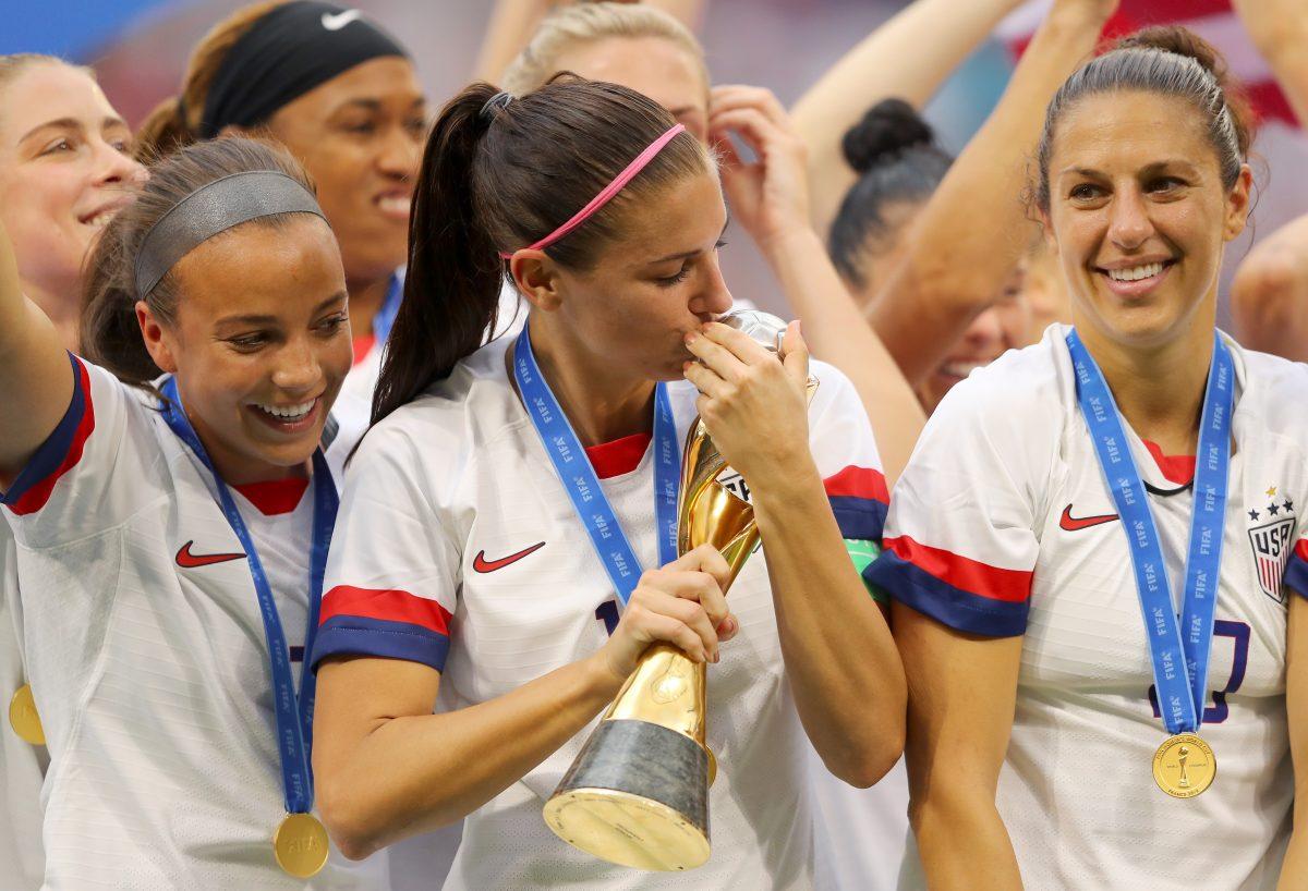 Alex Morgan of the United States kisses the FIFA Women's World Cup Trophy following her team's victory in the 2019 FIFA Women's World Cup France Final match between The United States of America and The Netherlands at Stade de Lyon in Lyon, France, on July 7, 2019. (Richard Heathcote/Getty Images)