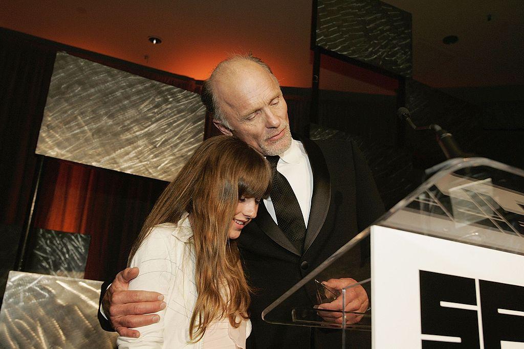 Ed Harris savors a tender moment with Lily as he accepts an award at the San Francisco International Film Festival in 2006 (©Getty Images | <a href="https://www.gettyimages.com/detail/news-photo/actor-ed-harris-enjoys-a-moment-with-his-daughter-lily-news-photo/57481716">David Paul Morris</a>)
