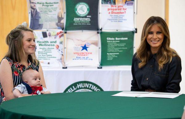 US First Lady Melania Trump speaks with Megan Pawley, a mother in recovery, and her 4-month-old son, Huck, during a small group discussion about the opioid crisis at the Cabell-Huntington Health Department in Huntington, West Virginia on July 8, 2019. (SAUL LOEB/AFP/Getty Images)