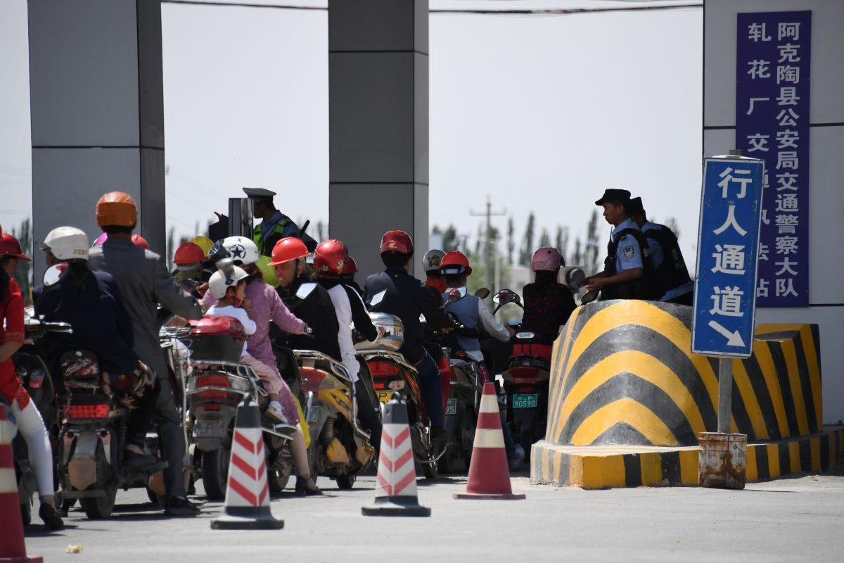 A police checkpoint on a road near a facility believed to be a re-education camp where mostly Muslim ethnic minorities are detained, north of Akto in China's western Xinjiang region, on June 4, 2019. (Greg Baker/AFP/Getty Images)
