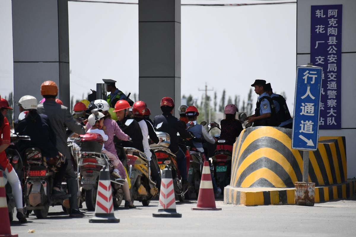 A police checkpoint on a road near a facility believed to be a re-education camp where mostly Muslim ethnic minorities are detained, north of Akto in China's western Xinjiang region, on June 4, 2019. (Greg Baker/AFP/Getty Images)
