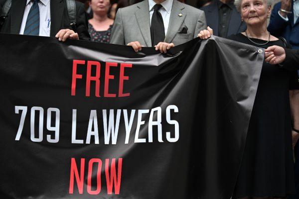 Lawyers and activists gather for a silent protest at the court of final appeal in Hong Kong for the fourth anniversary of the "709" clampdown on human rights lawyers across China on July 9, 2019. (Anthony Wallace/AFP/Getty Images)