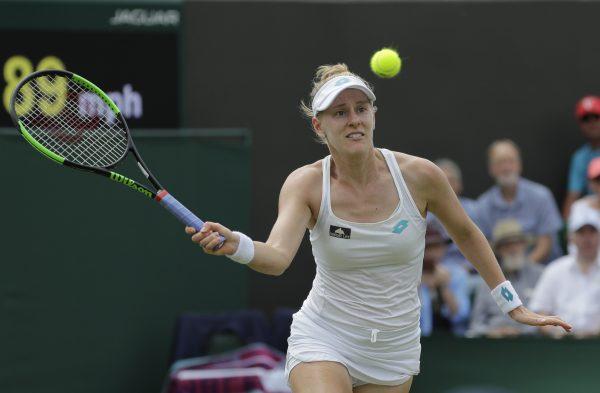 United States' Alison Riske returns the ball to Australia's Ashleigh Barty in a women's singles match during day seven of the Wimbledon Tennis Championships in London on July 8, 2019. (Ben Curtis/Photo/AP)