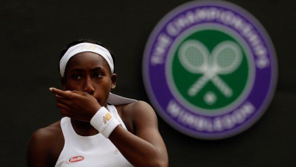 United States' Cori "Coco" Gauff wipes her face during a women's singles match against Romania's Simona Halep on day seven of the Wimbledon Tennis Championships in London on July 8, 2019. (Kirsty Wigglesworth/Photo/AP)