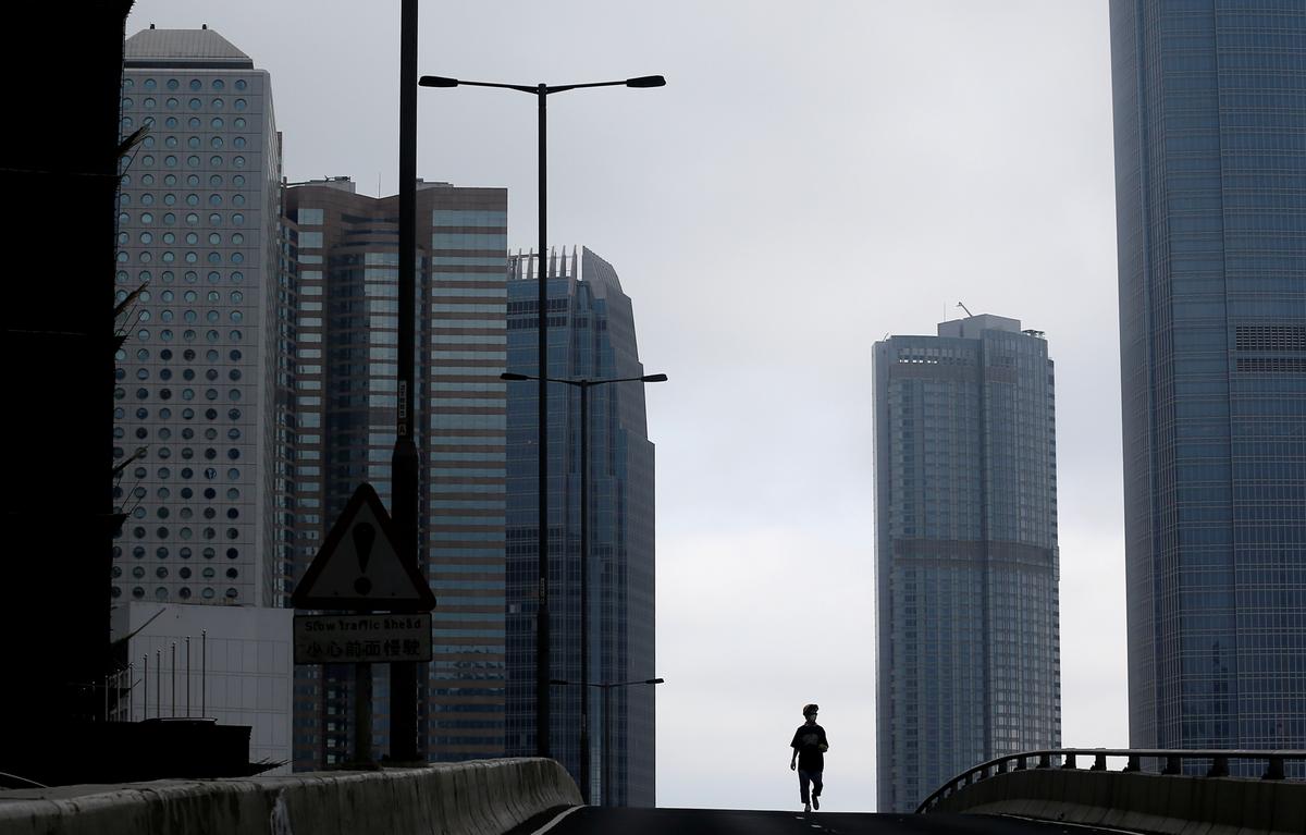 A lone protester walks on the flyover at the occupied Harcourt Road, near the Legislative Council building, amidst demonstrations against the extradition bill in Hong Kong, China on June 17, 2019. (Thomas Peter/Reuters)