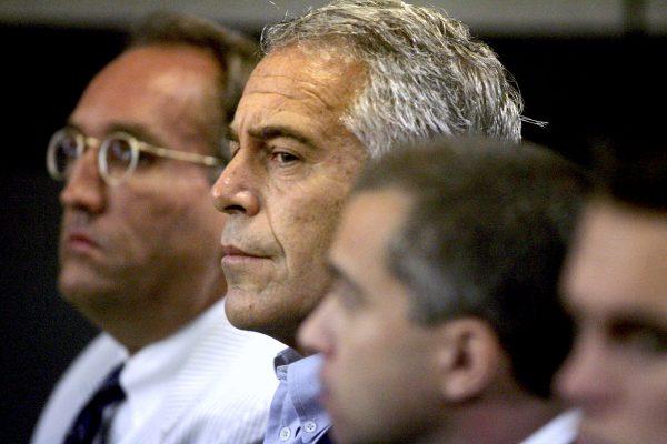 In this July 30, 2008, file photo, Jeffrey Epstein, center, appears in court in West Palm Beach, Fla. (Uma Sanghvi/Palm Beach Post via AP, File)