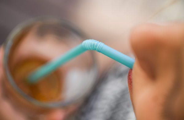 A woman drinking with a plastic straw. (Patrick Pleul/AFP/Getty Images)