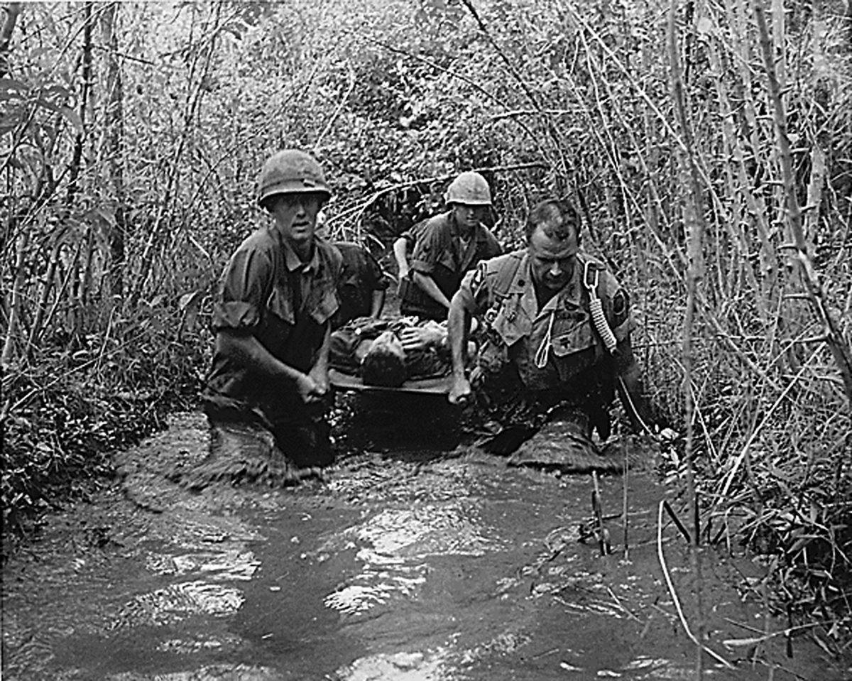 It was not all good news in the summer of 1969; the Vietnam War was still underway. U.S. soldiers carry a wounded comrade through a swampy area during action in Vietnam in 1969. (NATIONAL ARCHIVES/AFP/Getty Images)