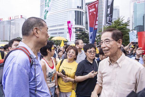 Hong Kong media tycoon and democracy campaigner Jimmy Lai (left) joins a protest against a controversial extradition bill in Hong Kong on April 28, 2019. (Yu Gang/The Epoch Times)