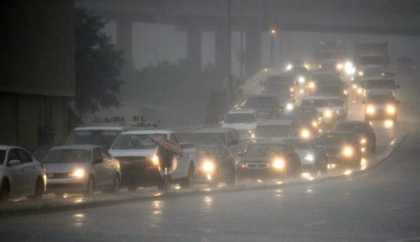 Traffic backs up as rain come down at Airline Drive and S. Carrollton Ave. in New Orleans, as severe thunderstorms cause street flooding Wednesday,on July 10, 2019. (Max Becherer/The Advocate via AP)