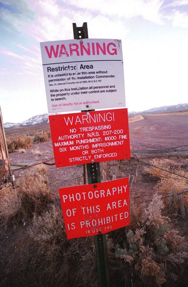This photo taken on March 12, 2000, shows a warning sign marking the boundary of Area 51, in Rachel, Nevada. (Dan Callister/Getty Images)
