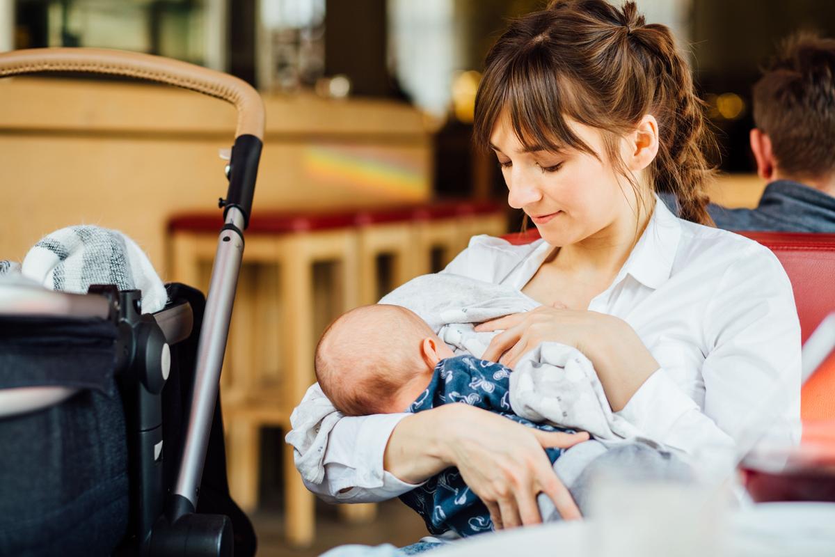 Illustration - Shutterstock | <a href="https://www.shutterstock.com/image-photo/young-mother-breastfeeding-her-baby-cafe-618574628?studio=1">Iryna Inshyna</a>